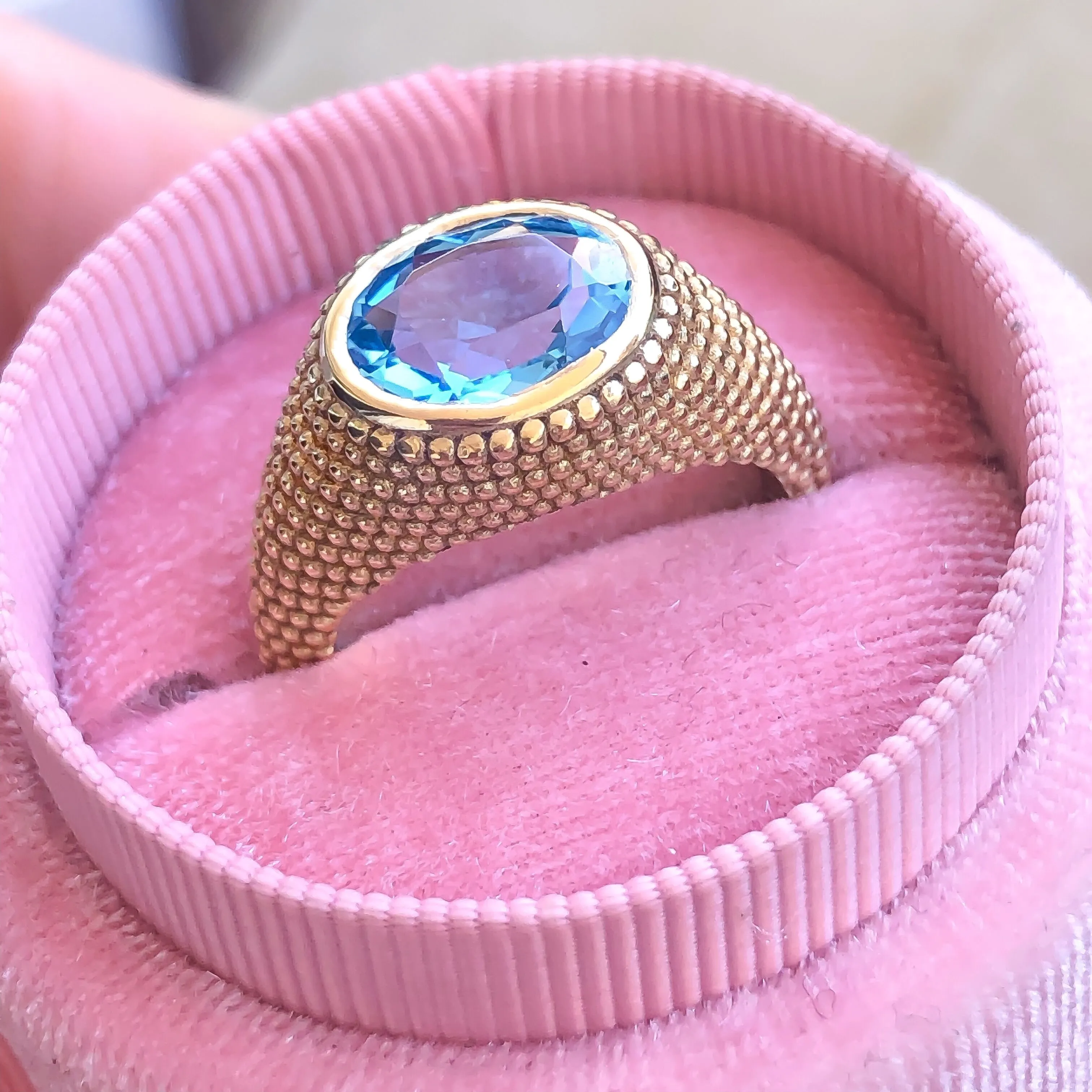 Nubia Oval Blue Topaz Yellow Gold Ring Size 7US