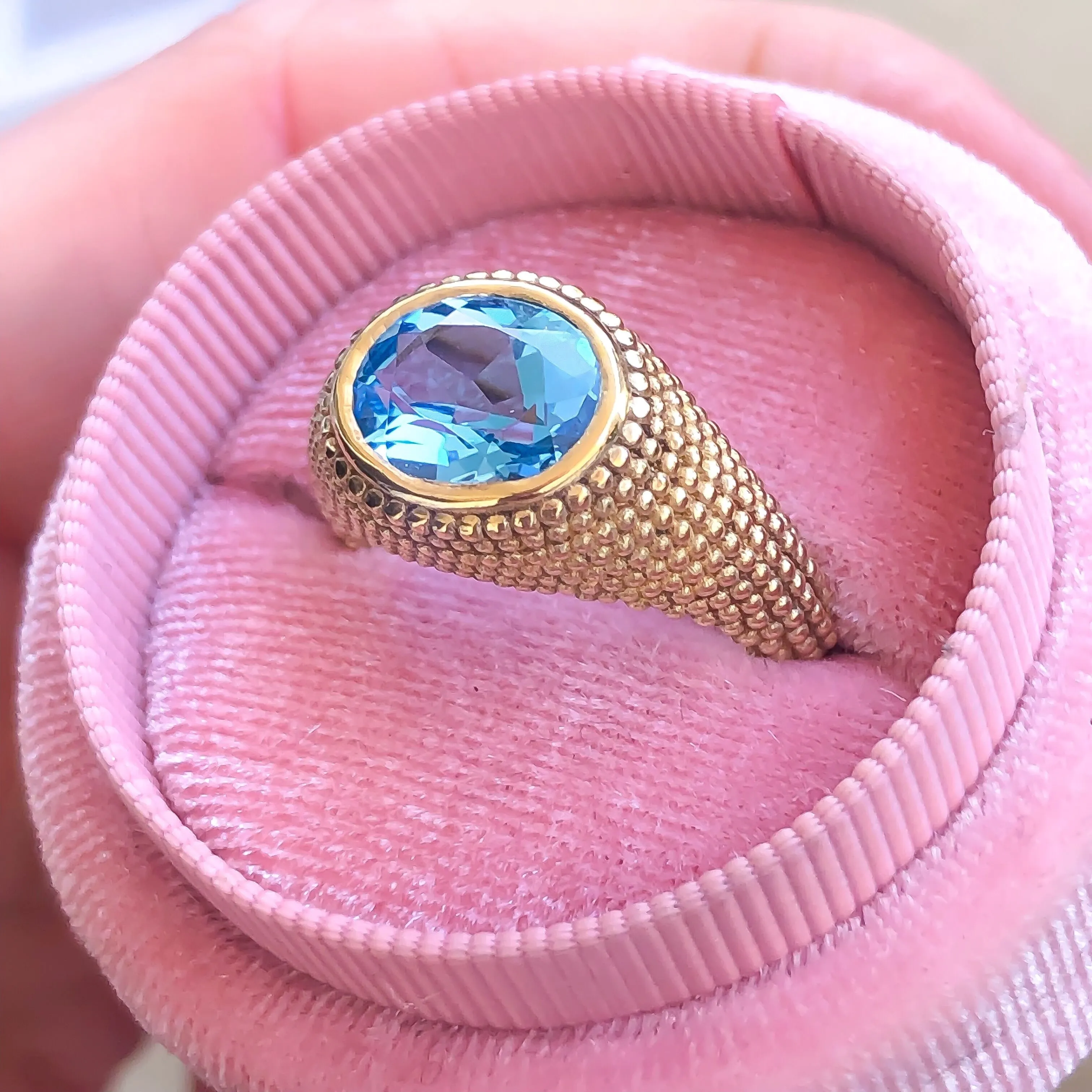 Nubia Oval Blue Topaz Yellow Gold Ring Size 7US