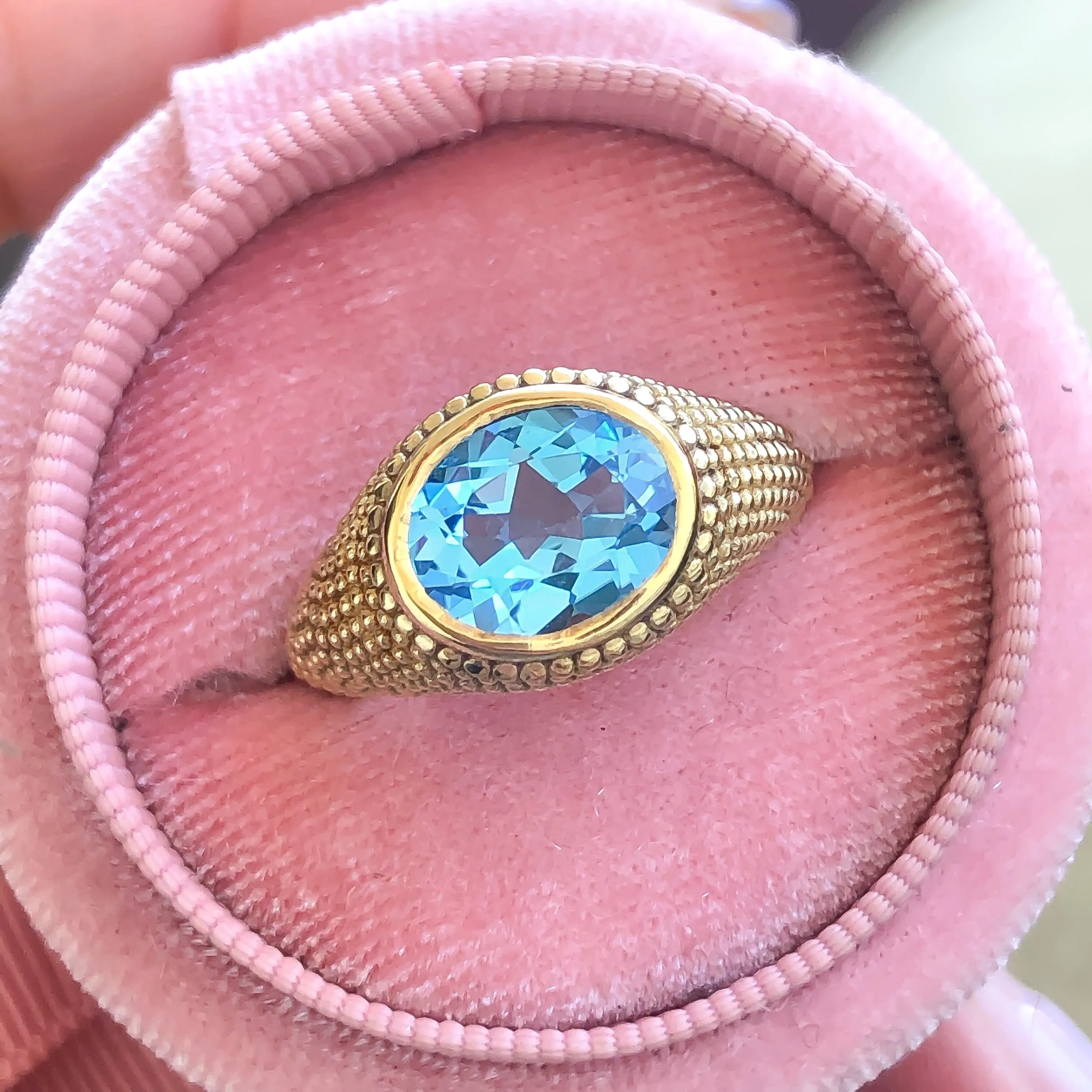 Nubia Oval Blue Topaz Yellow Gold Ring Size 7US