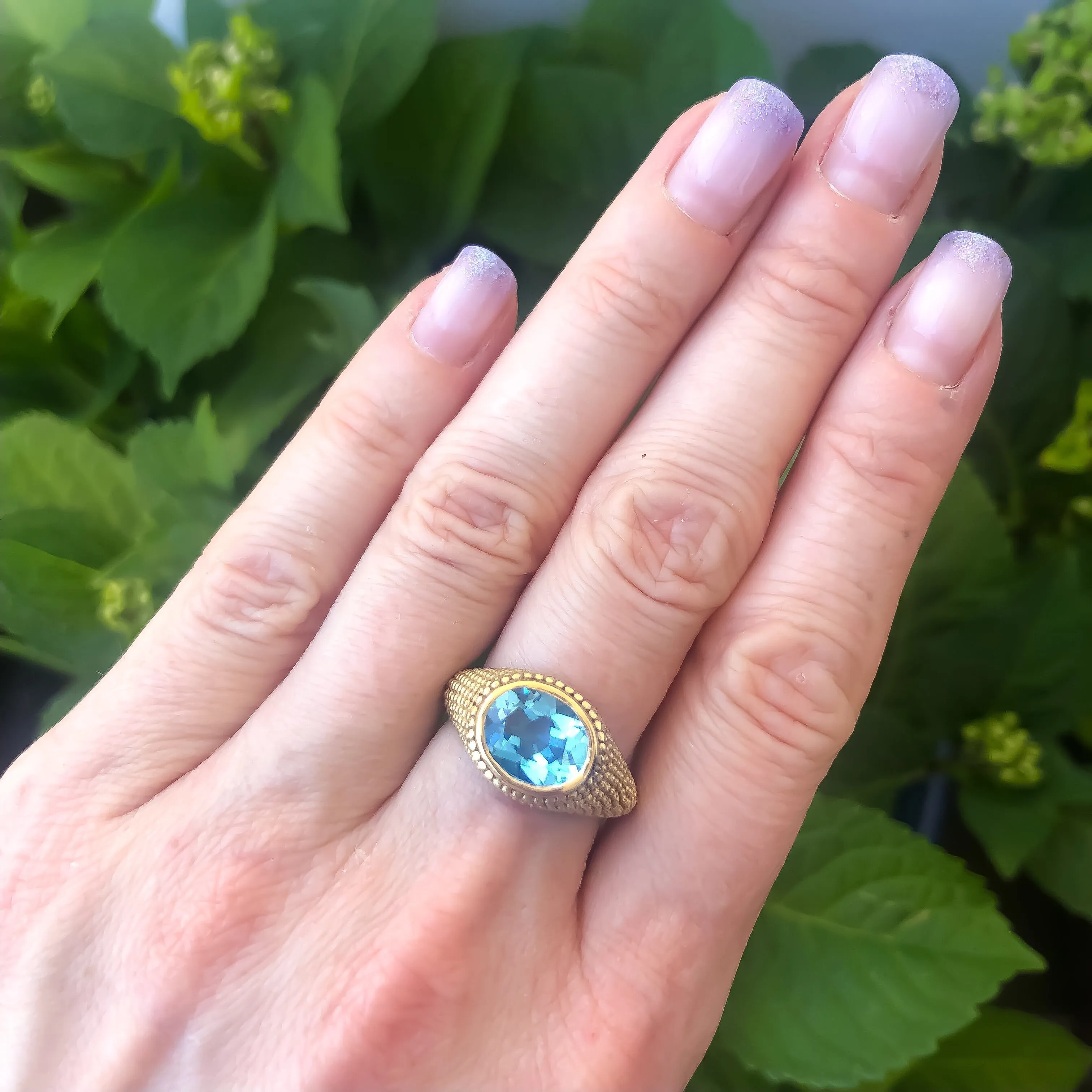 Nubia Oval Blue Topaz Yellow Gold Ring Size 7US